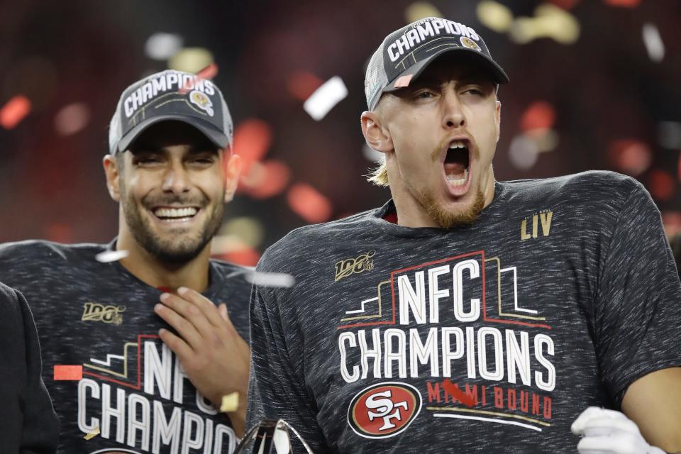 San Francisco 49ers quarterback Jimmy Garoppolo, left, and tight end George Kittle celebrate after the NFL NFC Championship football game against the Green Bay Packers