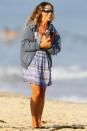 <p>Sarah Jessica Parker soaks up the sun and gets in some reading while on the beach in The Hamptons, New York, on Wednesday.</p>