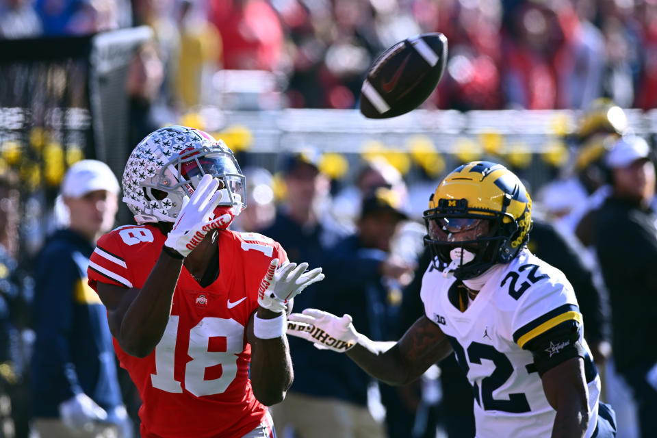 COLUMBUS, OHIO - NOVEMBER 26: Marvin Harrison Jr. #18 of the Ohio State Buckeyes makes a touchdown catch during the second quarter of a game against the Michigan Wolverines at Ohio Stadium on November 26, 2022 in Columbus, Ohio. (Photo by Ben Jackson/Getty Images)