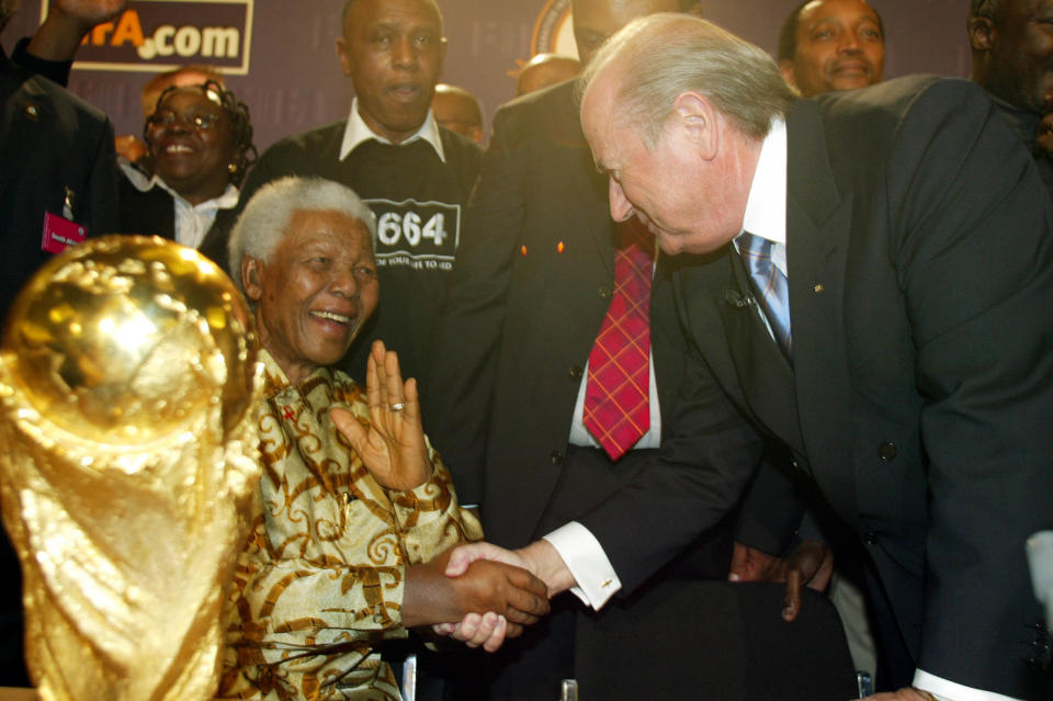 FIFA President Sepp Blatter congratulates former South African President Nelson Mandela after South Africa were awarded the host nation for the 2010 World Cup (Photo by Adam Davy/EMPICS via Getty Images)