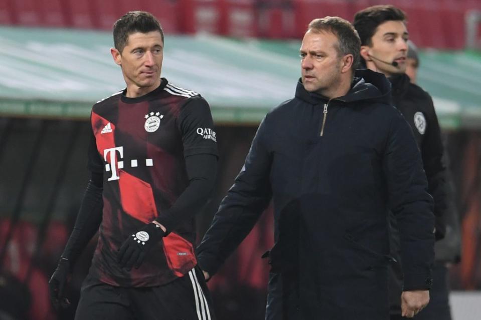 Robert Lewandowski and Hansi Flick formed a deadly duo at <a class="link " href="https://sports.yahoo.com/soccer/teams/bayern-munich/" data-i13n="sec:content-canvas;subsec:anchor_text;elm:context_link" data-ylk="slk:Bayern Munich;sec:content-canvas;subsec:anchor_text;elm:context_link;itc:0">Bayern Munich</a>. (Photo by ANDREAS GEBERT/POOL/AFP via Getty Images)