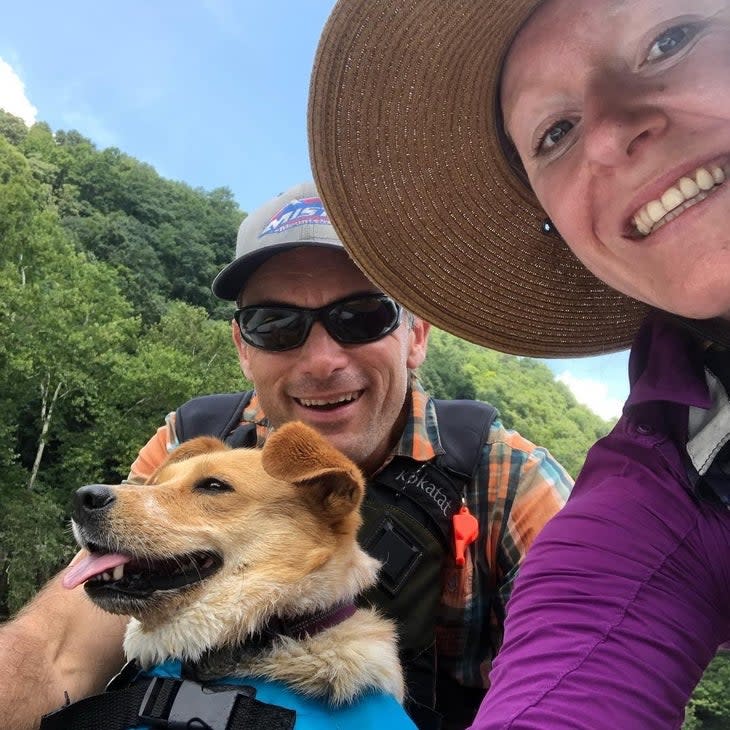 <span class="article__caption">Paul Nelson, his dog Meadow, and wife Miranda on the New River. (Photo: Miranda Nelson)</span>