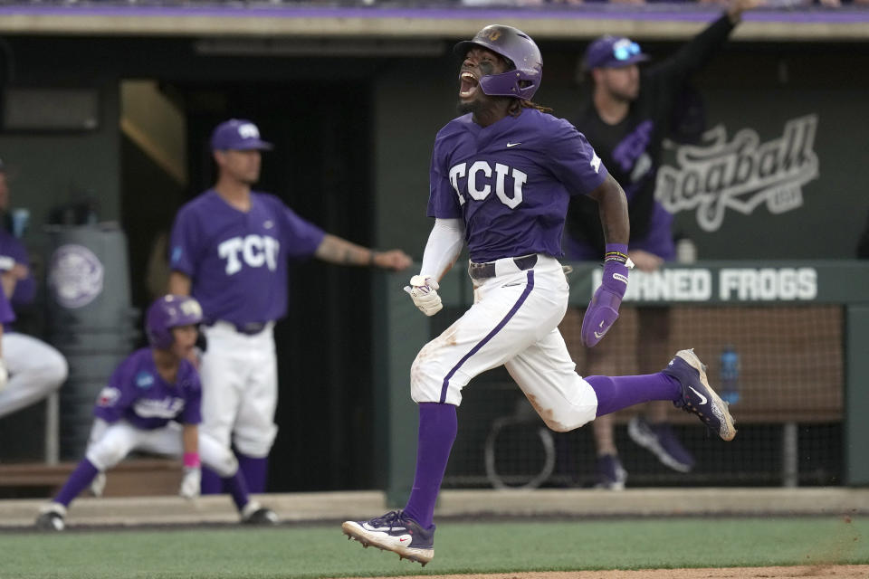 TCU's Tre Richardson yells as he runs in to score on a single by teammate Anthony Silva during the fourth inning of an NCAA college baseball super regional game against Indiana State in Fort Worth, Texas, Saturday, June 10, 2023. (AP Photo/LM Otero)