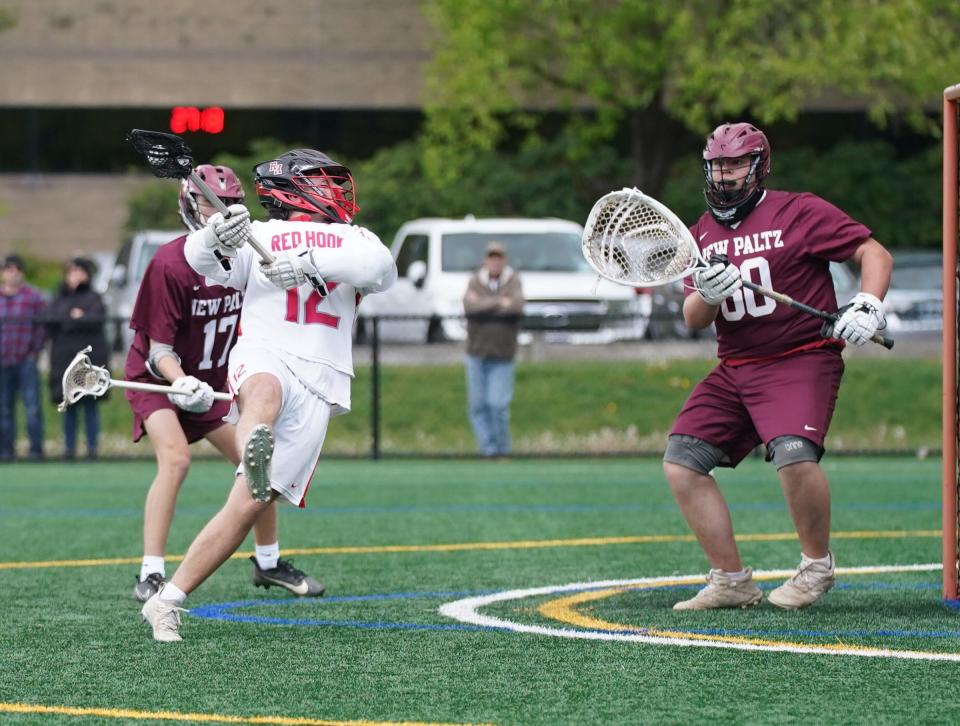 Red Hook's Mickey Mrzyglod (12) puts a shot goal during their 17-5 win over New Paltz in boys lacrosse action at Bard College in Annandale-on-Hudson on Wednesday, May 3, 2023. 