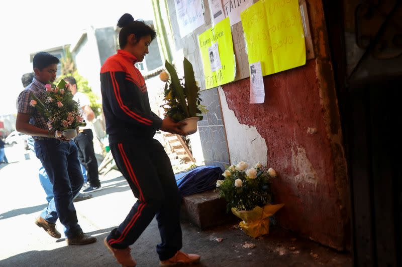 People arrive at the home of seven-year-old Fatima Cecilia Aldrighett, who went missing on February 11 and whose body was discovered over the weekend inside a plastic garbage bag, in Mexico City