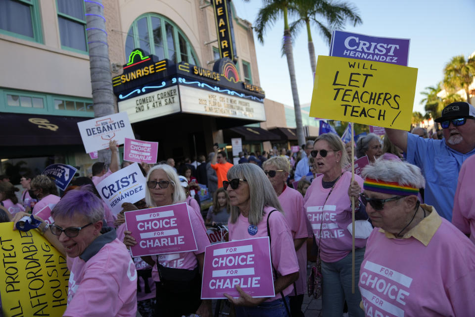 Supporters of Democratic candidate for governor Charlie Crist arrive outside the Sunrise Theatre ahead of a debate between Crist and Florida Republican Gov. Ron DeSantis in Fort Pierce, Fla., Monday, Oct. 24, 2022. (AP Photo/Rebecca Blackwell)