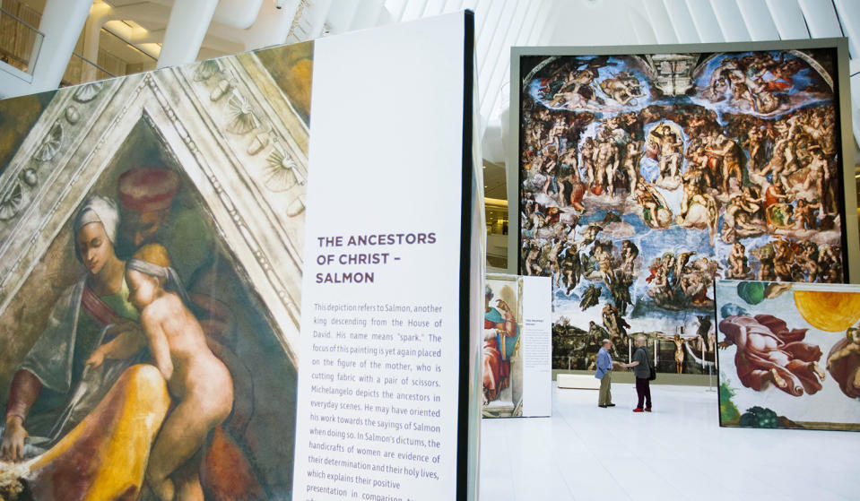 <p>Guests explore the “Up Close: Michelangelo’s Sistine Chapel” re-creation exhibit at the Oculus at Westfield World Trade Center in New York. The exhibit features 34 reproductions, including “The Creation of Adam” and “The Last Judgement.” (AP Photo/Michael Noble Jr.) </p>