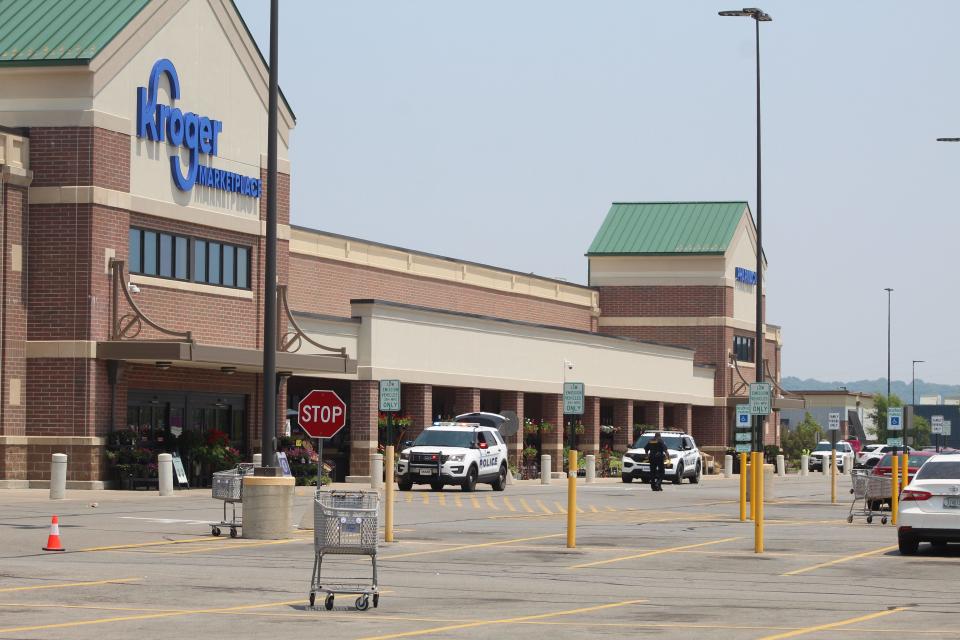 Cincinnati police cordoned off access to the Kroger Marketplace in Oakley after a bomb threat June 10.