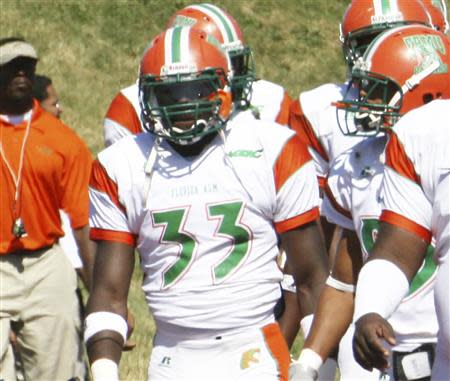 Jonathan Ferrell (C) is pictured alongside teammates of his Florida A&M University "Rattlers" football team in an undated handout photo provided by the university. REUTERS/Vaughn Wilson/FAMU Athletics/Handout via Reuters