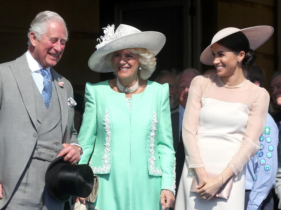 Meghan Markle with Prince Charles and Camilla at Prince Charles' birthday event in 2018