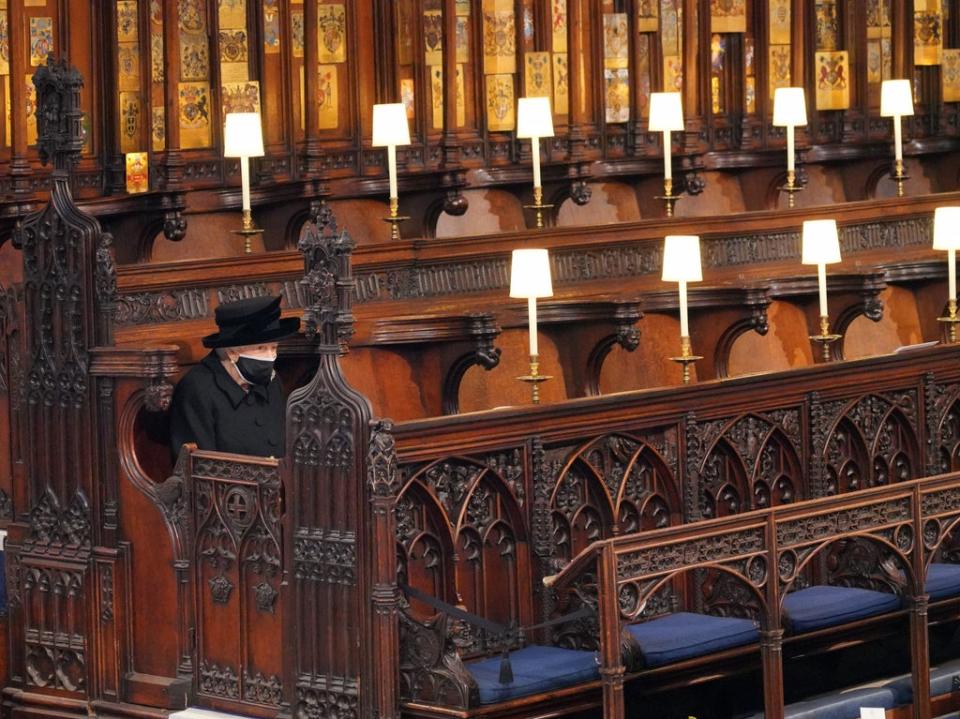 The Queen sits alone during the funeral of her husband, the Duke of Edinburgh, in St George’s Chapel, Windsor Castle, on 17 April 2021 (PA)