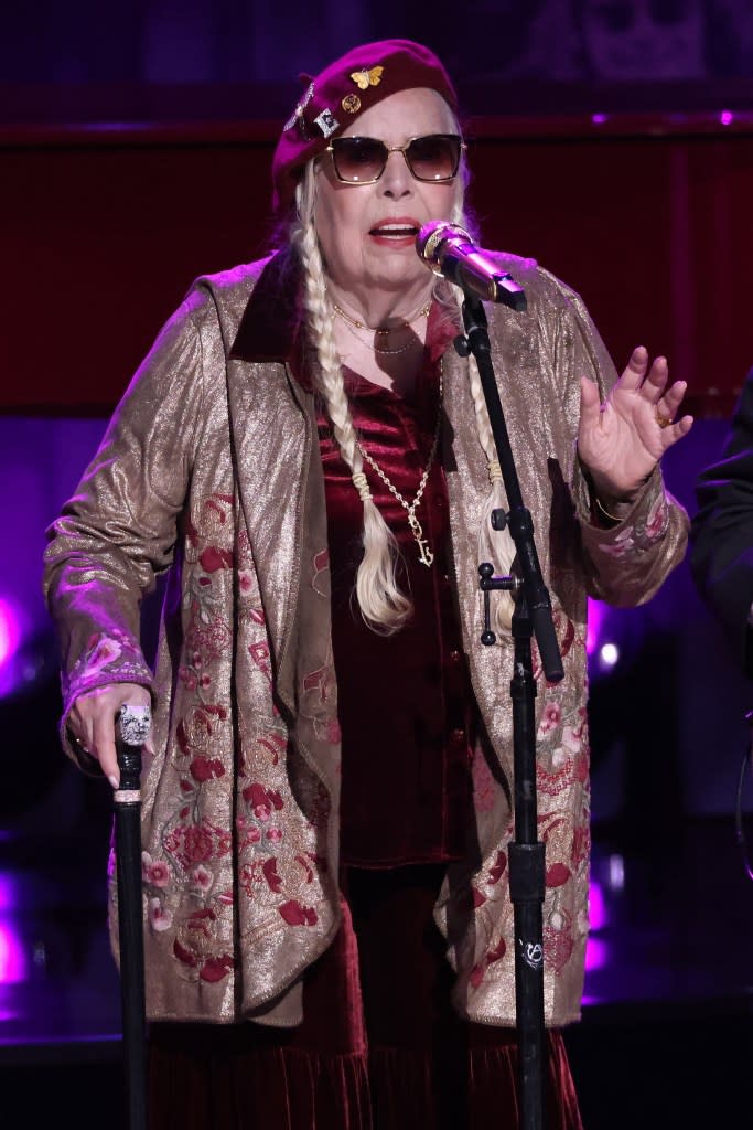 After the introduction, the Grammy winner and Rock & Roll Hall of Fame inductee took the stage wearing a crimson velvet dress and matching beret and managed to stand throughout the entire performance with the assistance of a cane. Taylor Hill/WireImage