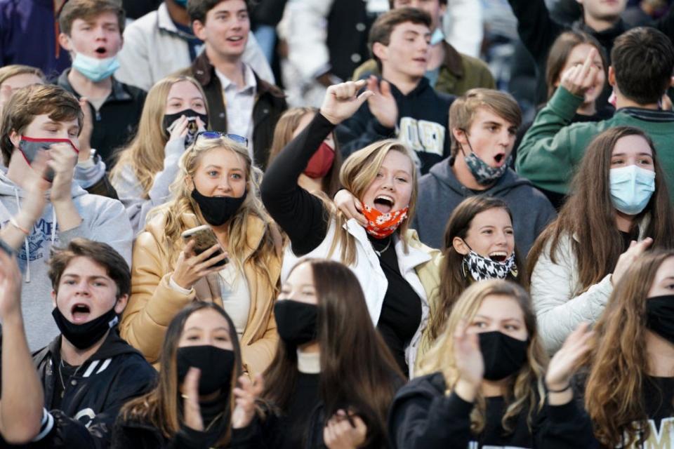 Dec. 5: Camden High School students — some maskless — cheer on their team in Columbia, South Carolina. (Getty Images)