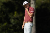 Cameron Smith, of Australia, reacts after missing a birdie putt on the 14th hole during the final round of the Masters golf tournament Sunday, Nov. 15, 2020, in Augusta, Ga. (AP Photo/David J. Phillip)