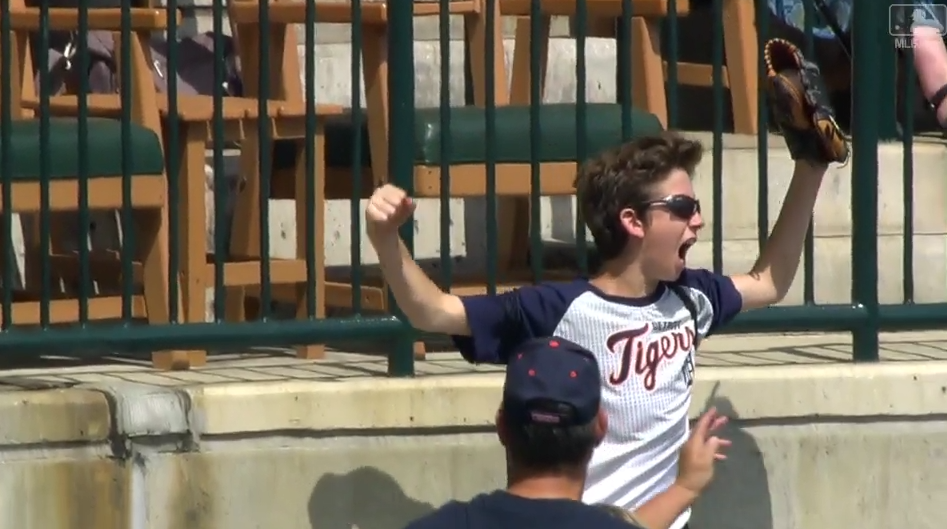 A young Tigers fan catches a foul ball and celebrates in the best way possible: by pulling a strongman pose. (MLB.com)