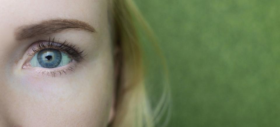 robot eye concept a close up of a girl eye, which has a chip implanted in