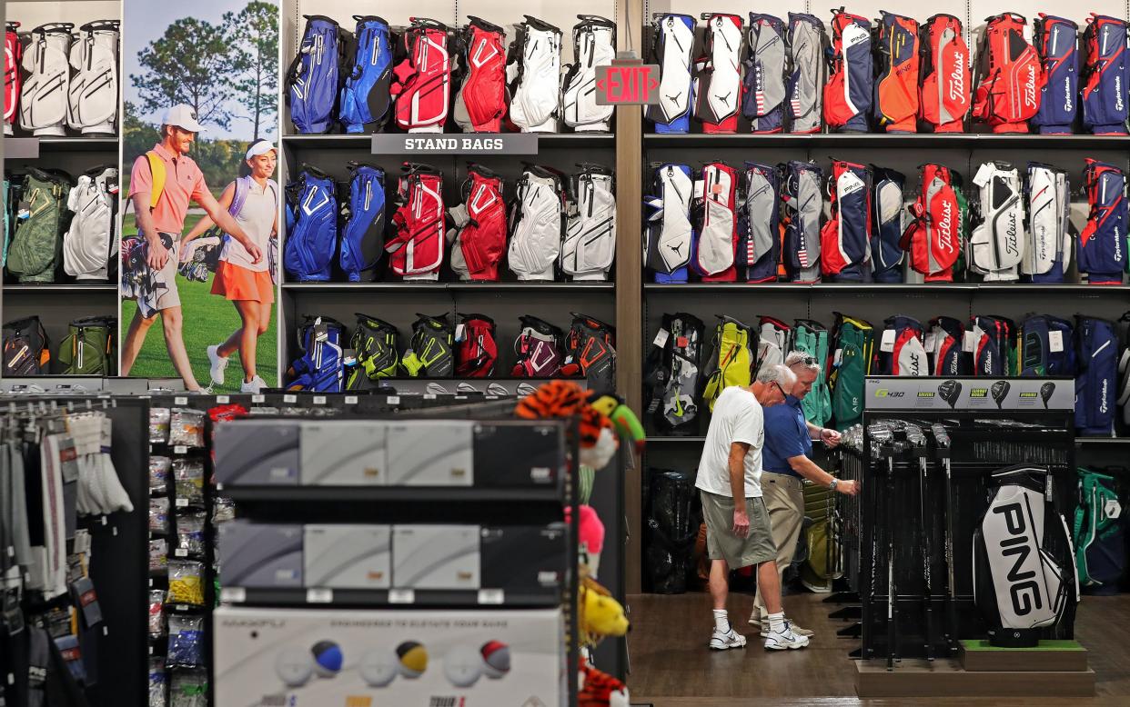 Customers shop for golf supplies Aug. 4 at the new Golf Galaxy on Cleveland-Massillon Road in Montrose.