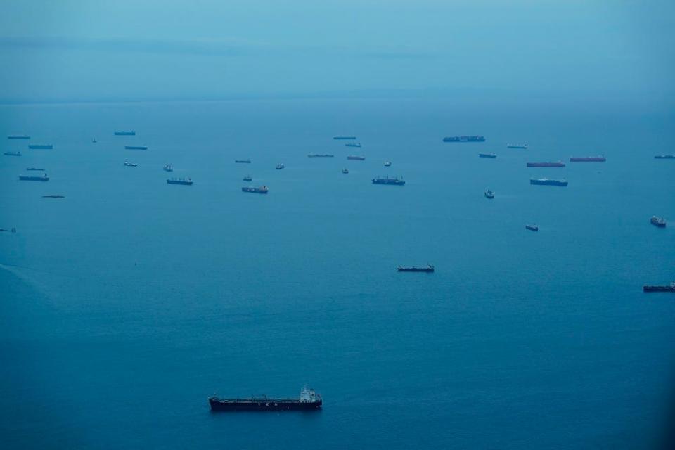 Dozens of ships viewed from a distance in Panama Bay for their transit through the Panama Canal on Sept. 23, 2023
