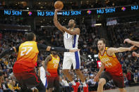 Indiana Pacers forward T.J. Warren (1) shoots as Utah Jazz's Rudy Gobert (27) and Bojan Bogdanovic (44) defend in the first half of an NBA basketball game Monday, Jan. 20, 2020, in Salt Lake City. (AP Photo/Rick Bowmer)