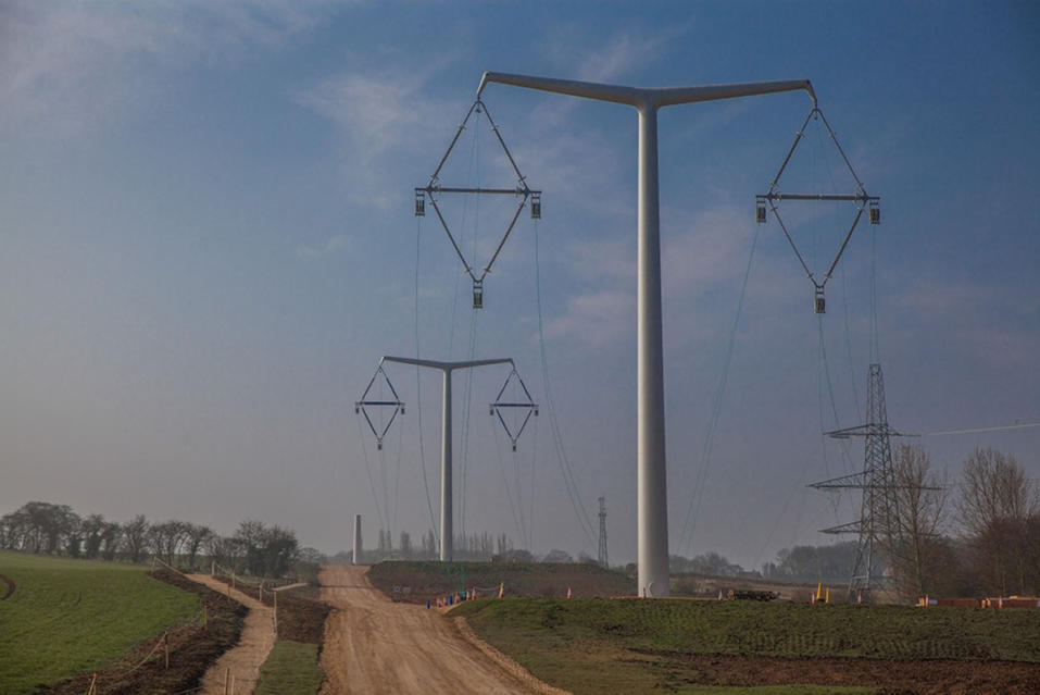 Undated handout photo issued by National Grid of their new T-pylon at the company's Eakring training academy in Nottinghamshire. PRESS ASSOCIATION Photo. Issue date: Thursday April 9, 2015. The T-pylon was the winner of an international design competition to look for a 21st century design to carry high voltage overhead lines.  The winning design from Bystrup, the Danish architects and engineering company, is 35 metres high - up to one third lower than the conventional steel lattice pylon. See PA story ENERGY Pylons. Photo credit should read: National Grid/PA WireNOTE TO EDITORS: This handout photo may only be used in for editorial reporting purposes for the contemporaneous illustration of events, things or the people in the image or facts mentioned in the caption. Reuse of the picture may require further permission from the copyright holder.