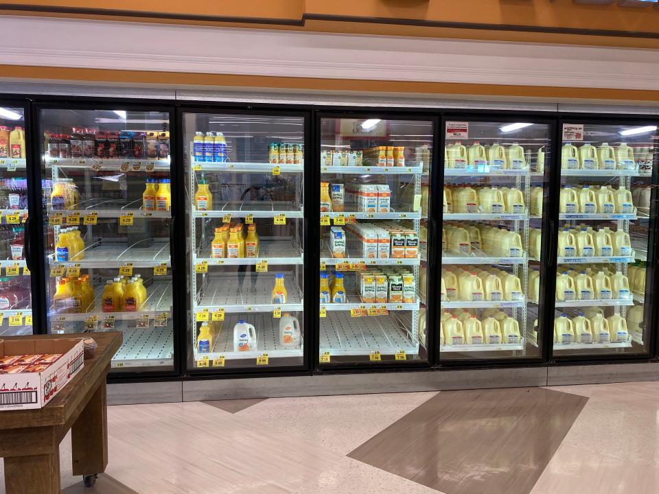 Many orange juice shelves sit empty at an Upstate grocery store on January 27, 2022.