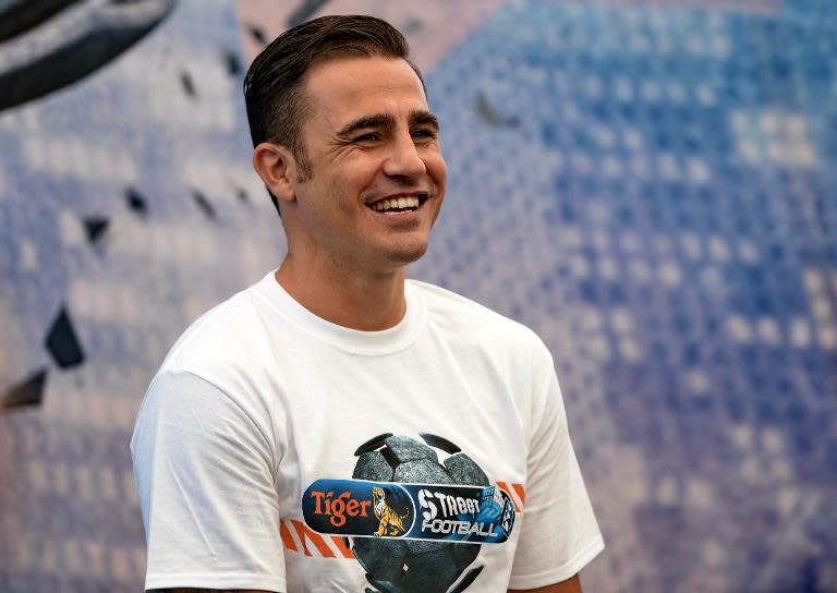 World Cup-winning captain Fabio Cannavaro attends a promotional event for Tiger Street Football in Singapore on October 17, 2013