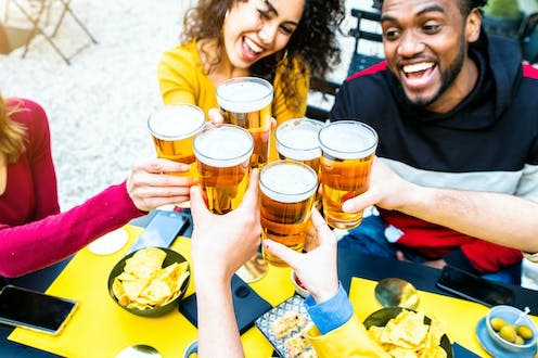 <span class="caption">Researchers have uncovered the likely genesis of the yeast used to make lager.</span> <span class="attribution"><a class="link " href="https://www.shutterstock.com/image-photo/group-multicultural-friends-drinking-toasting-beer-1957298368" rel="nofollow noopener" target="_blank" data-ylk="slk:DavidedeAngelini / Shutterstock;elm:context_link;itc:0;sec:content-canvas">DavidedeAngelini / Shutterstock</a></span>