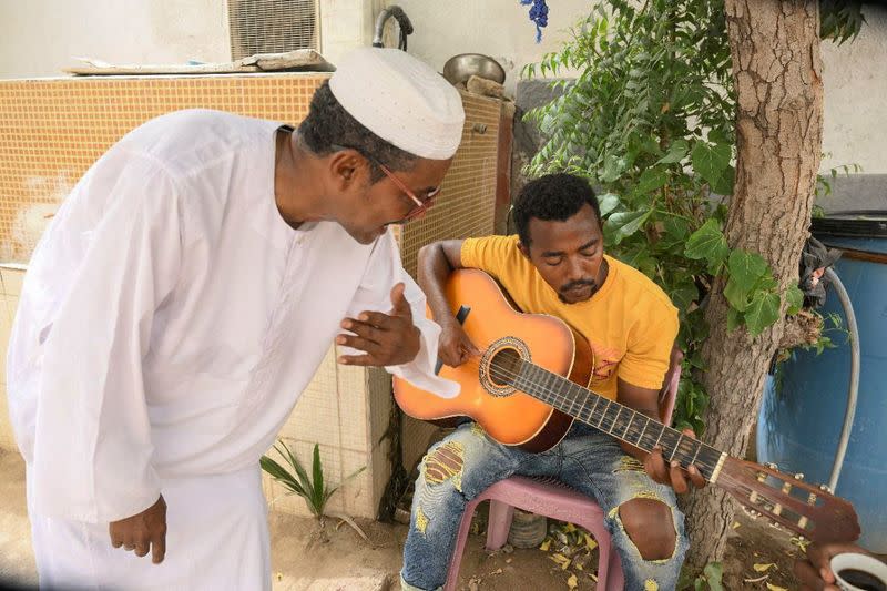 After Sudanese musician wife flees war, Sudanese music professor waits to travel to her in Port Sudan