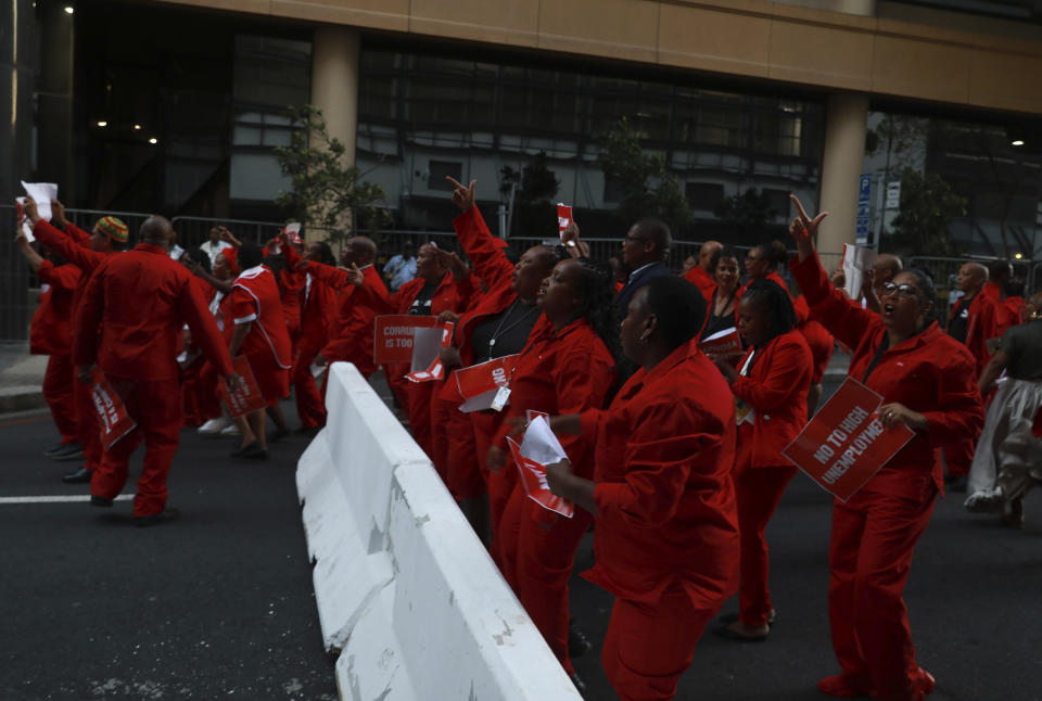 Members of the Economic Freedom Fighters (EFF) outside the city hall in Cape Town, South Africa, Thursday, Feb. 9, 2023, after disrupting South African President Cyril Ramaphosa's State of the Nation address. Ramaphosa is under pressure to convince the country that his government is addressing the nation's dire electricity crisis and bleak economic outlook in his annual State of the Nation Address. (AP Photo/Nardus Engelbrecht)