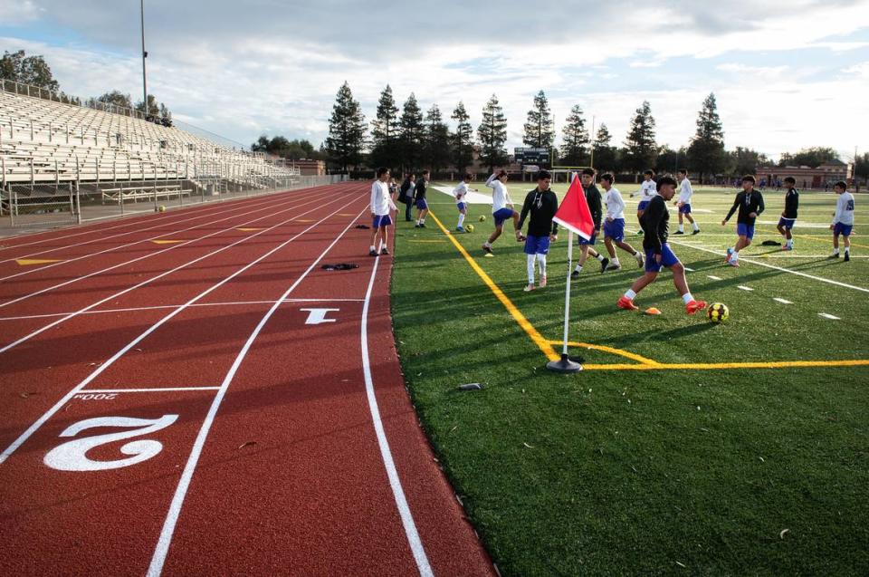 Modesto City Schools has just completed installing an all-weather track. Members of the Pacheco High junior varsity team warm up for a game at Johansen High School in Modesto, Calif., Friday, Jan. 13, 2023.