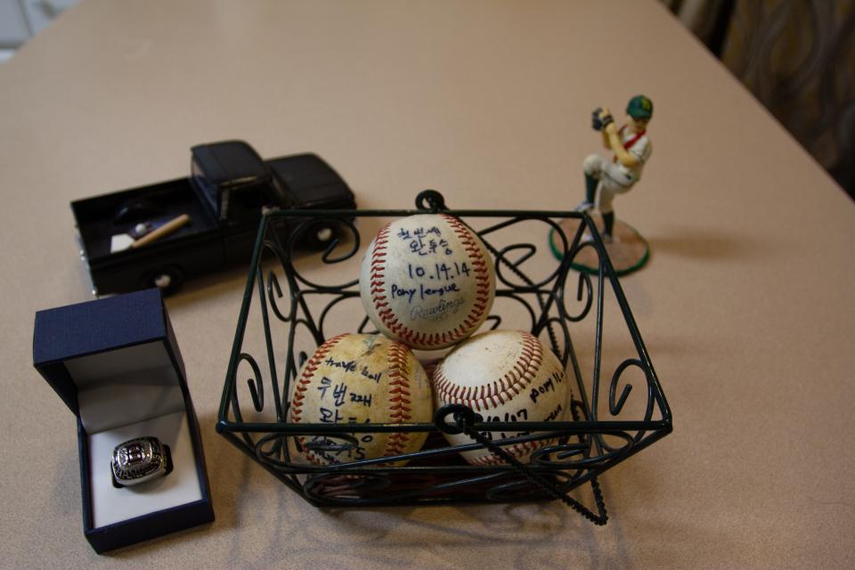 The Baek family’s collection of memorabilia from Sang Ho Baek’s baseball career, including Sang’s State Championship ring and game balls from two complete games and his first home run.