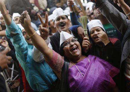 Supporters of Arvind Kejriwal, leader of the newly formed Aam Aadmi (Common Man) Party, celebrate after Kejriwal's election win against Delhi's chief minister Sheila Dikshit, in New Delhi December 8, 2013. REUTERS/Anindito Mukherjee