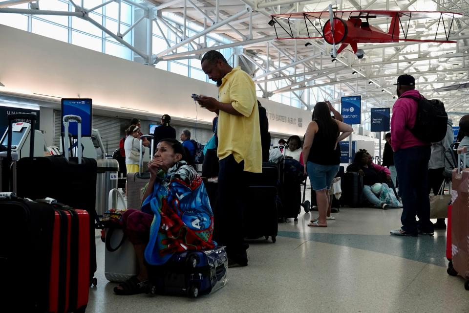 Travelers are left stranded at Fort Lauderdale Hollywood airport, Thursday, April 13, 2023 in Fort Lauderdale, Fla. Nearly a foot of rain fell in a matter of hours in Fort Lauderdale – causing widespread flooding, the closure of the city’s airport, all public schools and the suspension of high-speed commuter rail service. (Joe Cavaretta /South Florida Sun-Sentinel via AP)