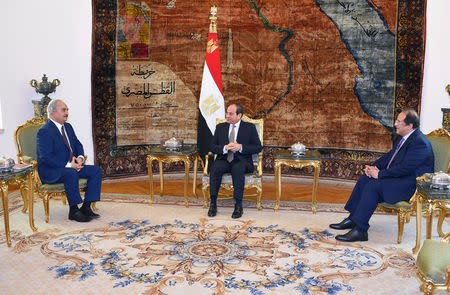 Libyan military commander Khalifa Haftar meets with Egyptian President Abdel Fattah al-Sisi at the Presidential Palace in Cairo, Egypt April 14, 2019 in this handout picture courtesy of the Egyptian Presidency. The Egyptian Presidency/Handout via REUTERS