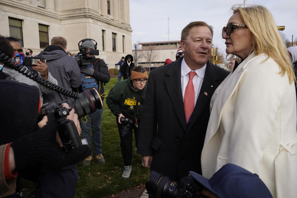 Mark McCloskey, second from right, a Republican candidate for U.S. Senate in Missouri, talks with his wife Patricia McCloskey outside the Kenosha County Courthouse, Tuesday, Nov. 16, 2021 in Kenosha, Wis., during the Kyle Rittenhouse murder trial. Rittenhouse is accused of killing two people and wounding a third during a protest over police brutality in Kenosha, last year. (AP Photo/Nam Y. Huh)