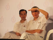 PM Lee sits with PAP Punggol East candidate Koh Poh Koon at the party's final rally. (Yahoo! photo/Alvin Ho)