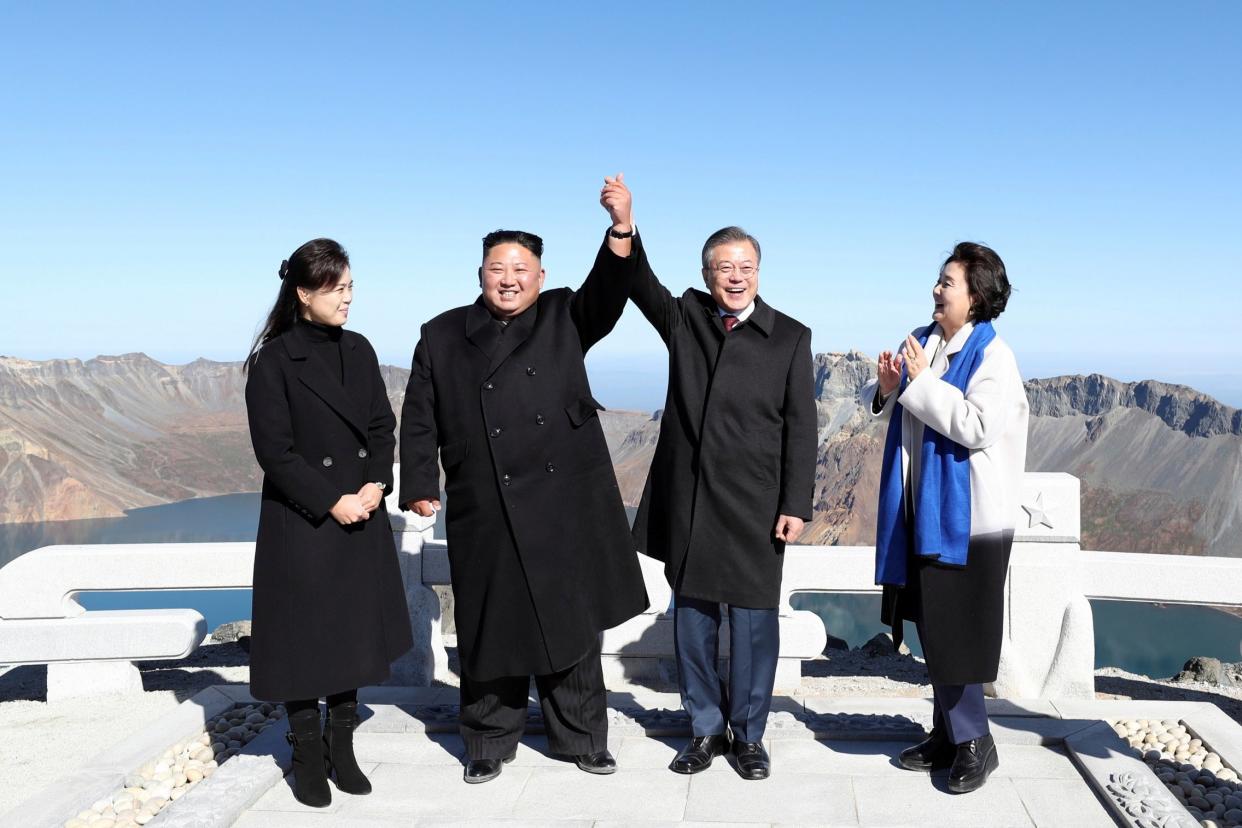 Show of unity: Kim Jong Un and his wife Ri Sol Ju with South Korean President Moon Jae-in and his wife Kim Jung-sook, right: AP