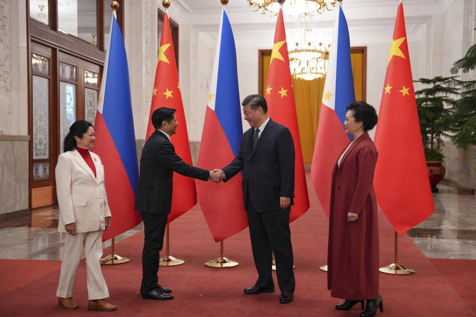 In this photo provided by the Philippines Office of the Press Secretary, Philippine President Ferdinand Marcos Jr., left, shakes hands with President Xi Jinping during a welcome ceremony at the Great Hall of the People in Beijing, Wednesday, Jan. 4, 2023. Marcos is pushing for closer economic ties on a visit to China that seeks to sidestep territorial disputes in the South China Sea. (Philippines Office of the Press Secretary via AP)