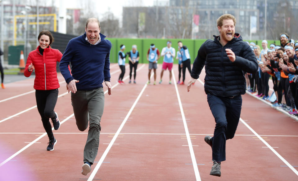 FILE - In this file photo dated Sunday, Feb. 5, 2017, Britain's Prince Harry, right, races to the line against Prince William, and Kate, the Duchess of Cambridge, left, during a training event to promote their charity Heads Together, at the Queen Elizabeth II Park in London. Many observers believe that the upcoming funeral for Prince Philip, on Saturday April 17, 2021, will provide an ideal opportunity for the brothers to smooth over tensions.(AP Photo/Alastair Grant, Pool)