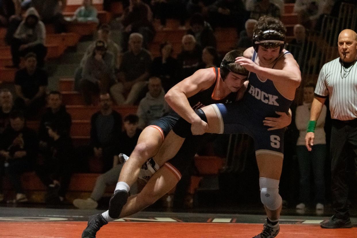 Pennsbury's Ben Primich, left, battles Council Rock South's Scott Linkewich in a 215-pound match, on Wednesday, January 24, 2024, at Pennsbury High School in Falls Township. The Golden Hawks defeated the Falcons 52-9.
