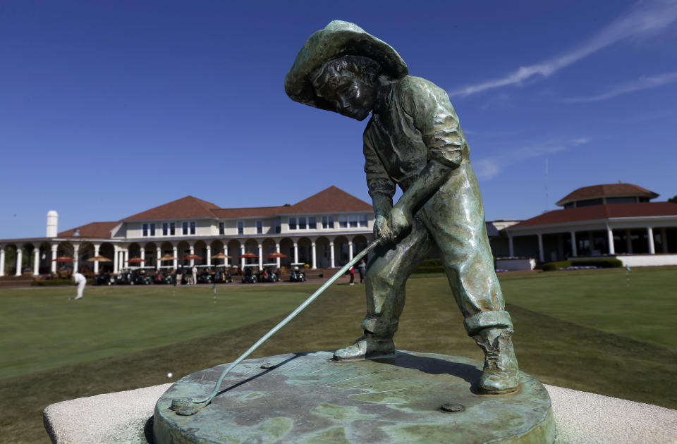 The "Putterboy" statue is shown at Pinehurst Resort & Country Club during media day for the upcoming back-to-back U.S. Open and U.S. Women's Open golf championships to be held this June in Pinehurst, N.C., Monday, April 21, 2014. (AP Photo/Gerry Broome)