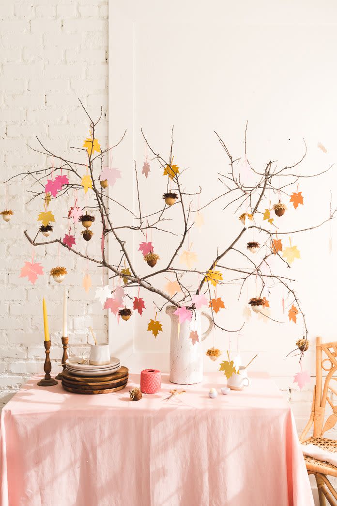 <p>Your guests will be grateful for the acorn favors that hang from this arrangement. Each one contains lip balm for when that cold November weather hits.</p><p><strong>Get the tutorial at <a href="http://thehousethatlarsbuilt.com/2018/10/gratitude-tree-acorn-favors.html/#more-35256" rel="nofollow noopener" target="_blank" data-ylk="slk:The House That Lars Built" class="link ">The House That Lars Built</a>.</strong></p><p><strong><a class="link " href="https://www.amazon.com/eos-Visibly-Soft-Balm-Sphere/dp/B01KA6ZDVO/?tag=syn-yahoo-20&ascsubtag=%5Bartid%7C10050.g.1371%5Bsrc%7Cyahoo-us" rel="nofollow noopener" target="_blank" data-ylk="slk:Shop Now">Shop Now</a><br></strong></p>