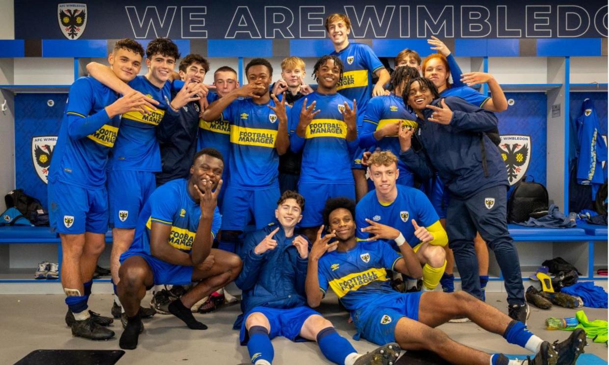 <span>AFC Wimbledon Under-18s celebrate victory over Blackburn in the FA Youth Cup in December; player-led matches are at the heart of their academy programme.</span><span>Photograph: AFC Wimbledon</span>
