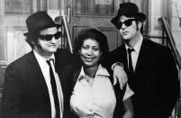 <p>Franklin poses with John Belushi and Dan Aykroyd on the set of The Blues Brothers, in 1980. She appeared in the film during a musical sequence of her hit song ‘Think.’ (Rex) </p>