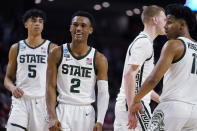 Michigan State's Tyson Walker (2) reacts after scoring during the second half of the team's college basketball game against Davidson in the first round of the NCAA men's tournament Friday, March 18, 2022, in Greenville, S.C. (AP Photo/Brynn Anderson)