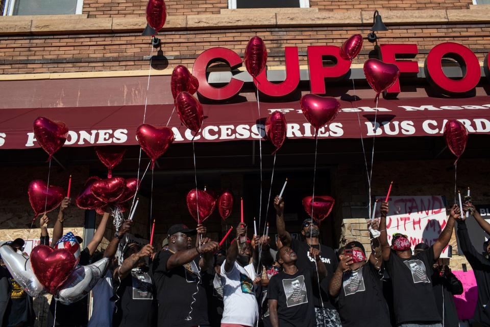 <p>Family and friends of George Floyd release balloons outside the place where he was killed by police. </p>