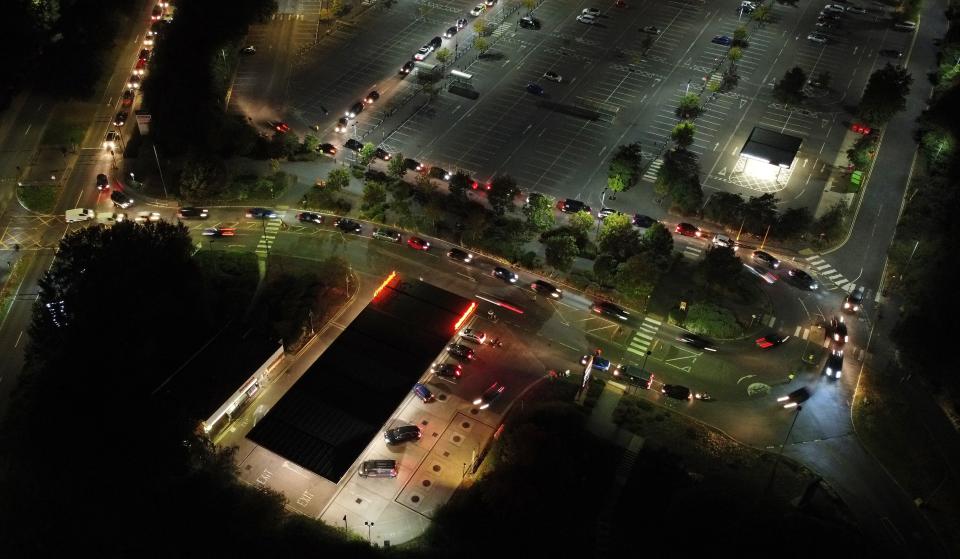 Motorists queue at a Sainsbury’s petrol station in Ashford, Kent (PA)