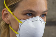 Israeli top model Bar Refaeli wears a face mask as she arrives to a court, in Tel Aviv, Israel, Monday, July 20, 2020. Refaeli signed a plea bargain agreement with authorities to settle a long-standing tax evasion case against her and her family. The deal will require Refaeli to serve nine months of community service while her mother, Zipi, will be sent to prison for 16 months. The two are also ordered to pay a $1.5 million fine on top of millions of back taxes owed to the state. (AP Photo/Oded Balilty, Pool)