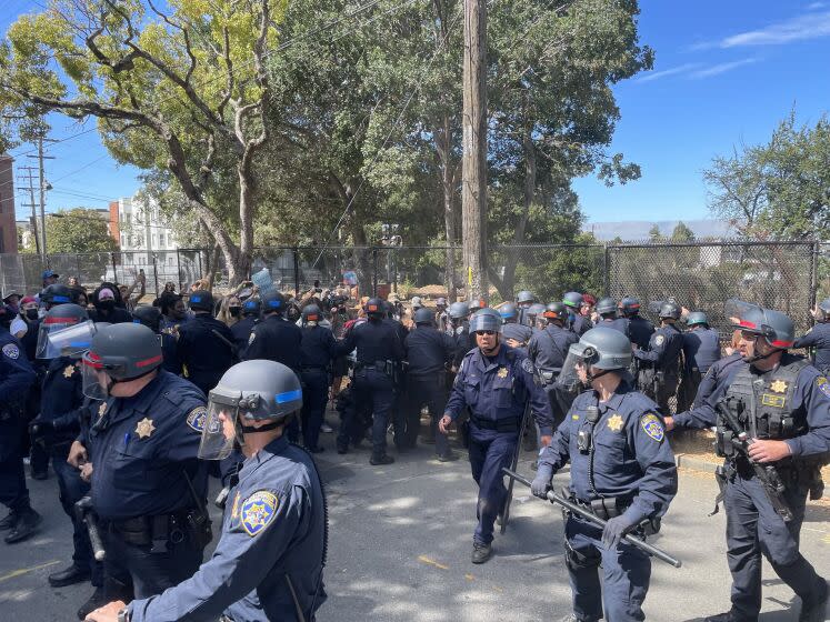 Protesters clash with police at People's Park in Berkeley on Wednesday, Aug. 3, 2022.