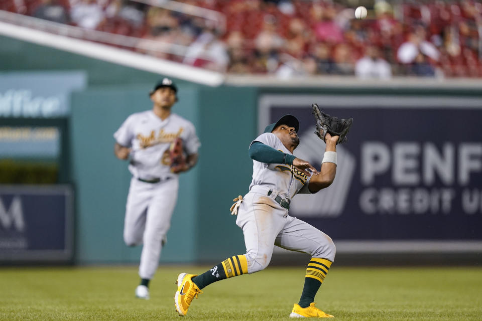 Oakland Athletics left fielder Tony Kemp catches a ball hit by Washington Nationals' Luis Garcia during the third inning of a baseball game at Nationals Park, Wednesday, Aug. 31, 2022, in Washington. (AP Photo/Alex Brandon)